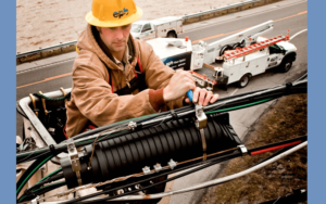 Technician on telephone pole